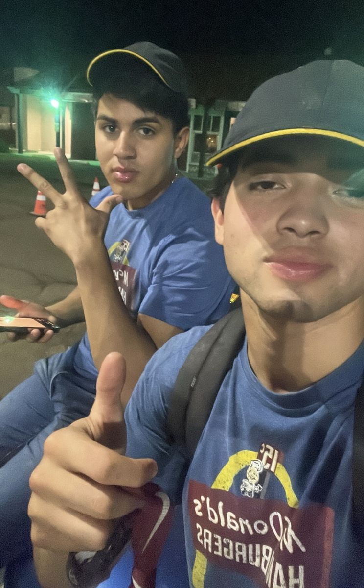 Abraham and Jose in uniform on a shift at McDonald's